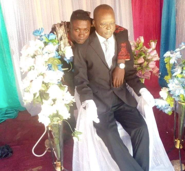 man poses with dead father