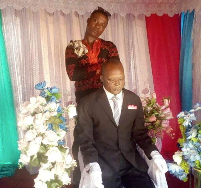 man poses with dead father