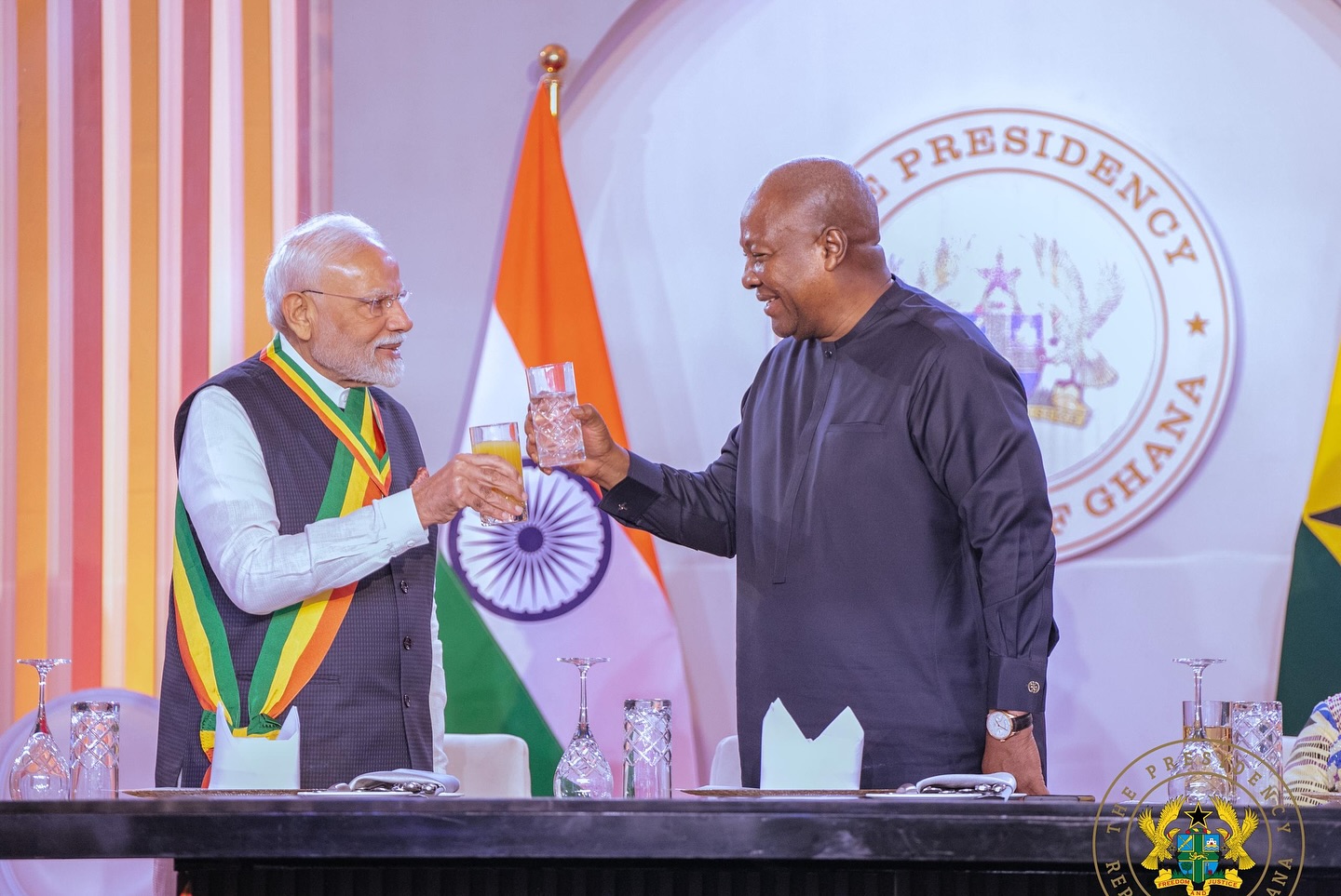 Photo of John Mahama toasting with Modi